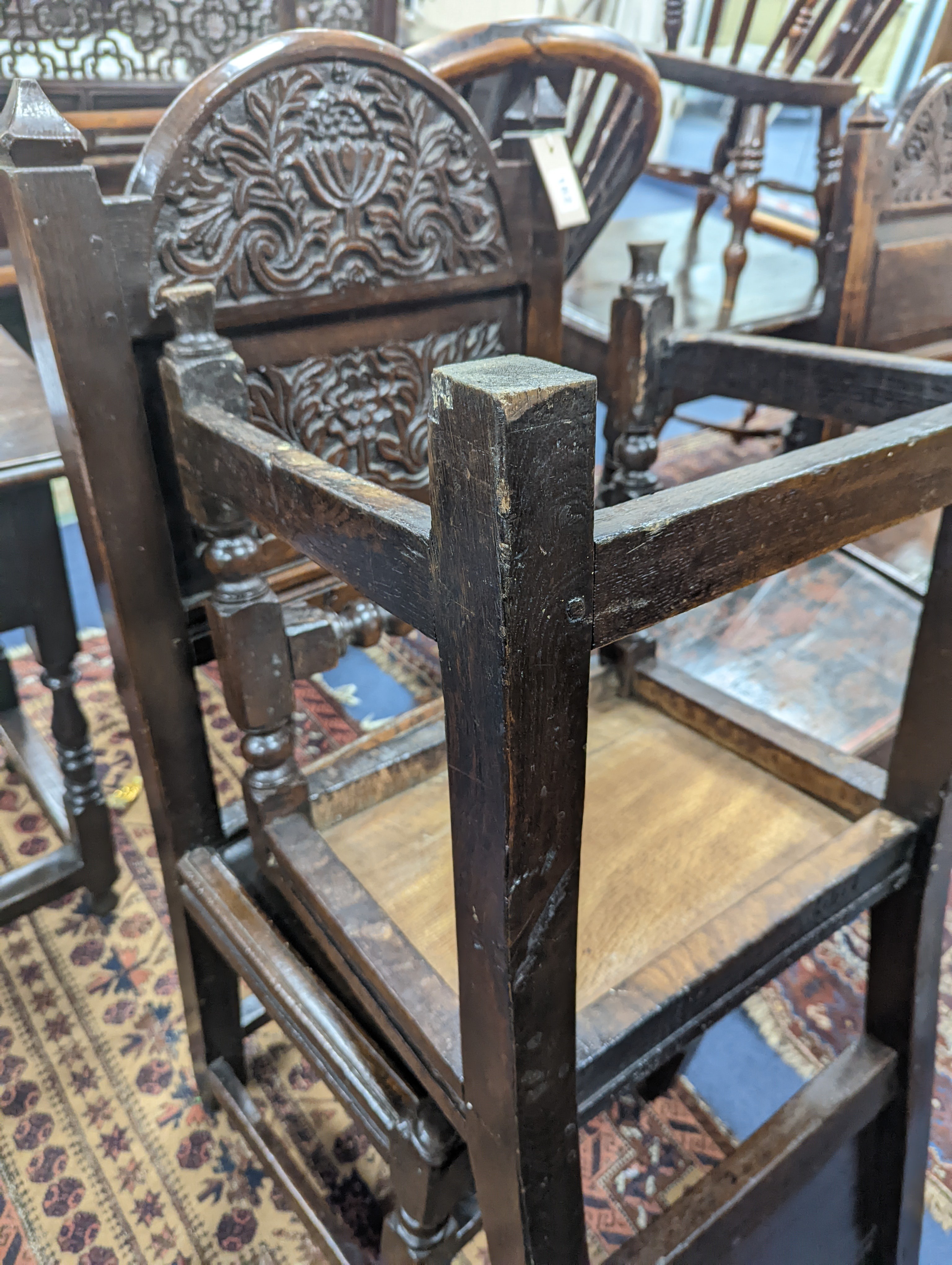 A pair of 17th century Lancashire carved oak side chairs, width 45cm, depth 39cm, height 101cm